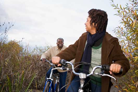 Senior couple bicycling together