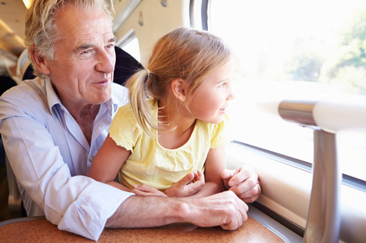 Grandfather and Granddaughter on a Train